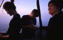 Taking inflight measurements of sun transparency and recording of altitude and flight path.