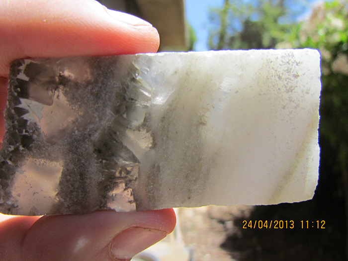 Deep below the seabed, drilling revealed thick layers of salt, precipitated out during past warm, dry periods. In this specimen, transparent crystals (left) formed on what was then the bottom during winter; finer white ones (right) formed on the water surface in summer and later sank. (Yael Kiro/Lamont-Doherty Earth Observatory) 