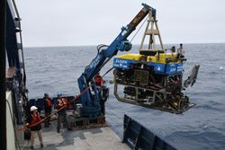 Crew members prepare the remotely operated vehicle Jason to dive to Axial Seamount.