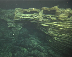 Lava erupted in April 2011 has flowed under an archway formed by an older eruption.