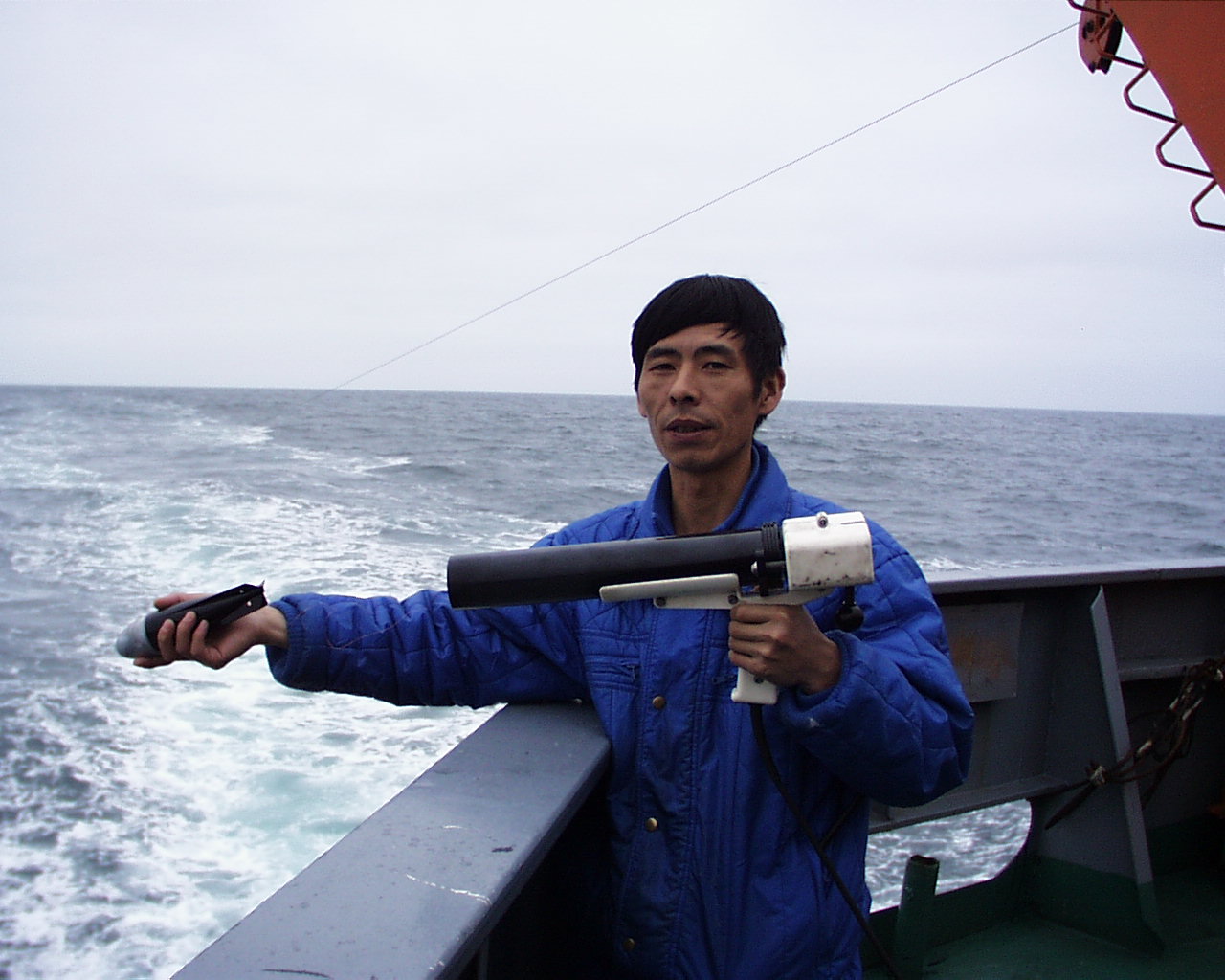 A XBT probe is launched through a handhold launcher from the fantail