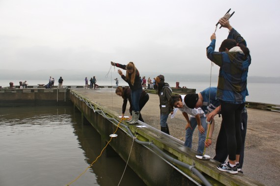 Local students sample the Hudson River in Piermont, N.Y. as part of the annual "A Day in the Life of the Hudson" event, led by education coordinator Margie Turrin.