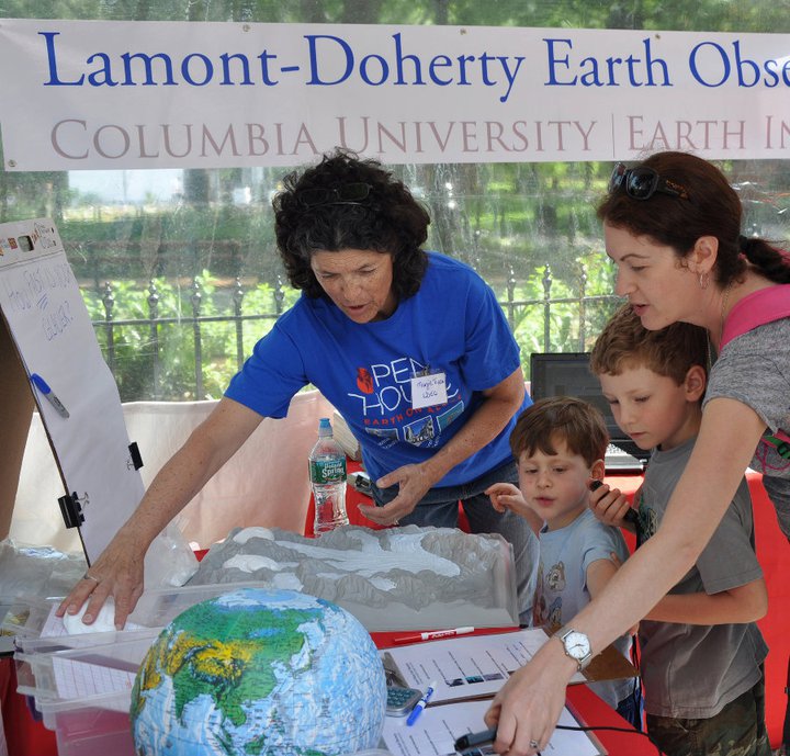 Lamont Education Coordinator Margie Turrin works with young enthusiasts at Lamont's World Science Festival booth.
