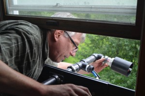 Lamont geochemist James Ross assembles an air sampler at home near where drilling is about to starts. The sampler is designed to detect fine dust and black carbon.