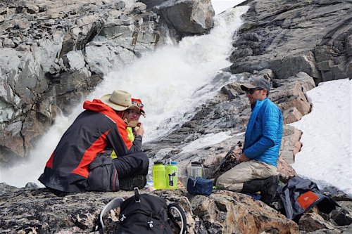 Waterfalls bring meltwater from the edge of the ice