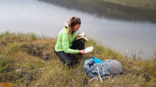 Allison collecting plant samples for leaf waxes