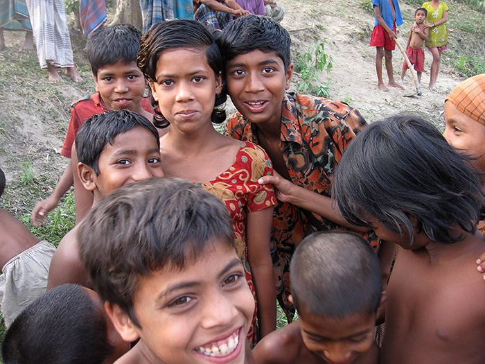Bangladesh, the most crowded nation on earth, sits atop what may be one of the planet’s most powerful seismic zones. Here, children north of the capital city of Dhaka greet earthquake researchers. (Kevin Krajick/Lamont-Doherty Earth Observatory)