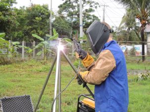 Keith welding the four rods together to make a stable monument.