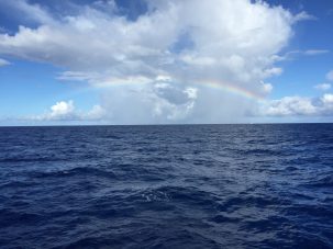 Even though this project necessitated round-the-clock sampling, it was hard not to take a minute to appreciate the beautiful scenery over the North Pacific. Photo: Kyle Frischkorn rainbow over the North Pacific Ocean