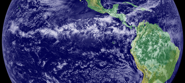 The Intertropical Convergence Zone (ITCZ) appears in this satellite image as the band of clouds circling the Earth near the equator. The image is a combination of cloud data from NOAA’s Geostationary Operational Environmental Satellite (GOES-11) and color land cover classification data. Credit: NOAA-NASA GOES Project