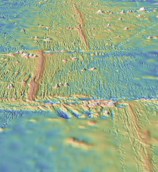 Modern mapping shows a mid-ocean ridge running from the top of the image to the bottom, with two transform faults running perpendicular to the ridge. Via GeoMapApp