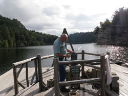A brass National Weather Service rain gauge at the resort’s boat dock is the 1896 original. Credit: Linda Keyes