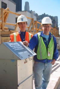 Alison Geyh and Steve Chillrud at WTC site with large-volume air sampler.